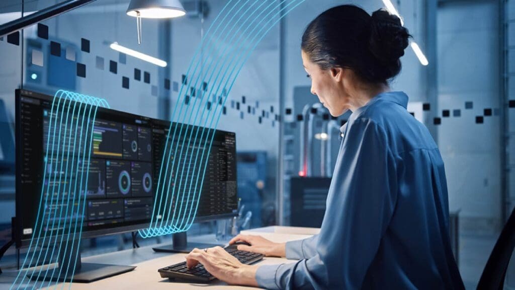 Employee using Cisco networking solutions on a secure business laptop